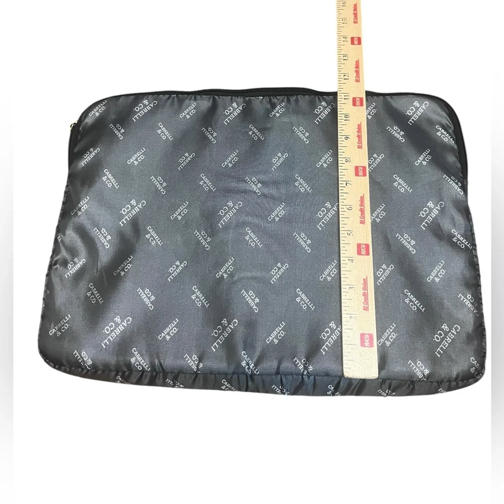 Silver and black Cabrelli & CO. inner laptop case